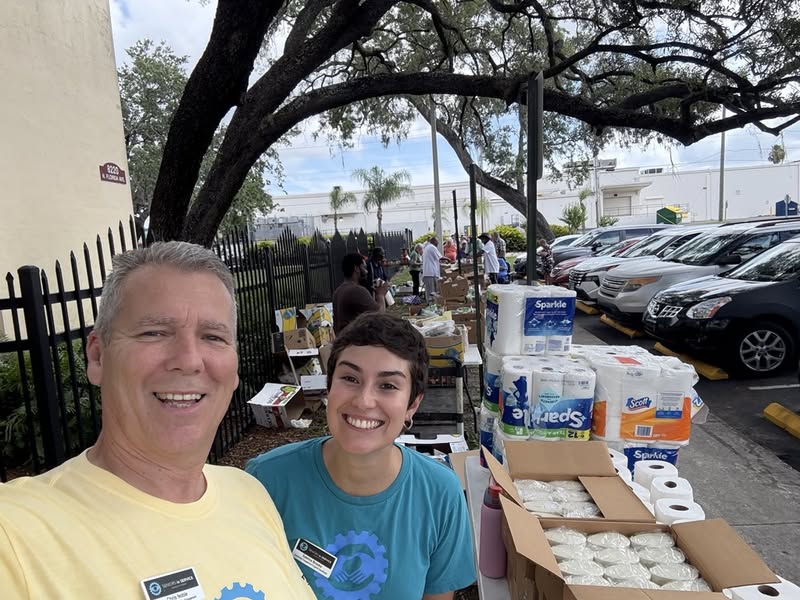 Seniors in Service volunteers at the Dream Builders Mission food pantry distribution at JL Young Apartments